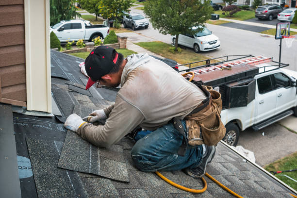 Professional Roofing technician working in Hilton, NY